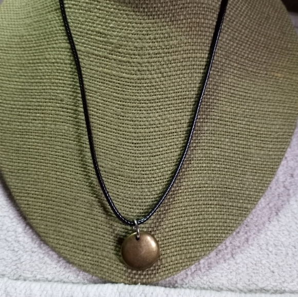 Goldtone round disk pendant on black cord necklace - Picture 3 of 4